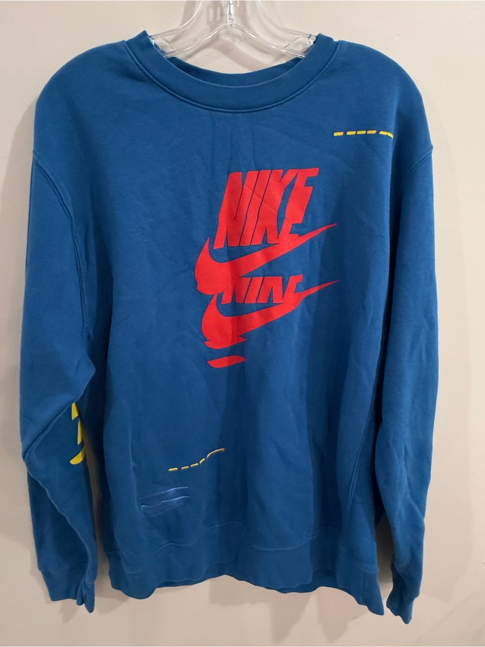 Nike Blue Crewneck Sweatshirt with Red Logo and Yellow Accents